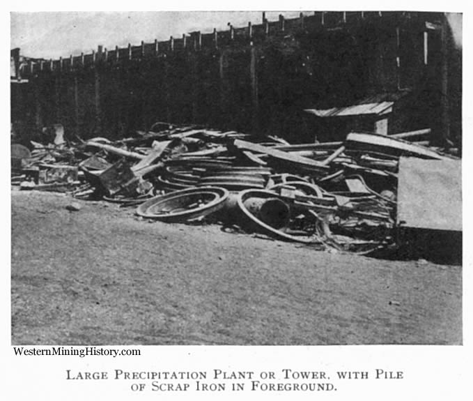 Large Precipitation Plant or Tower, With Pile of Scrap Iron in Foreground