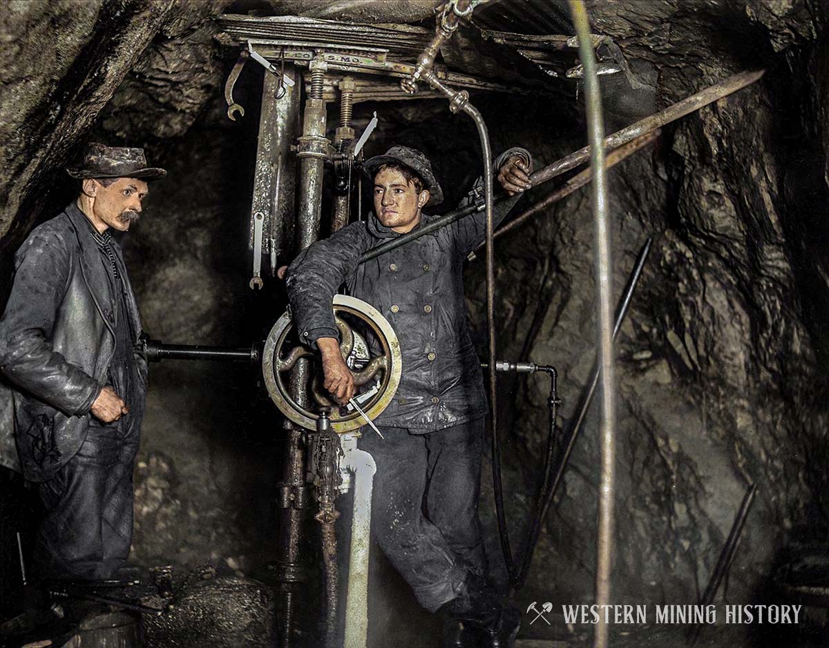 Miners with rock drill at the Camp Bird mine ca. 1900 (colorized)