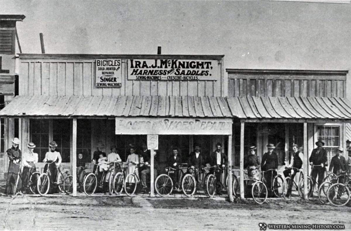 Cyclists pose at Cherry Creek, Nevada