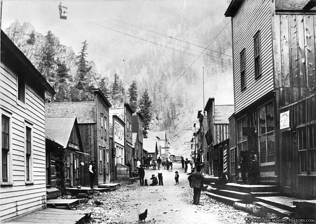 Man Aims Rifle at Chicken - Creede, Colorado 1892