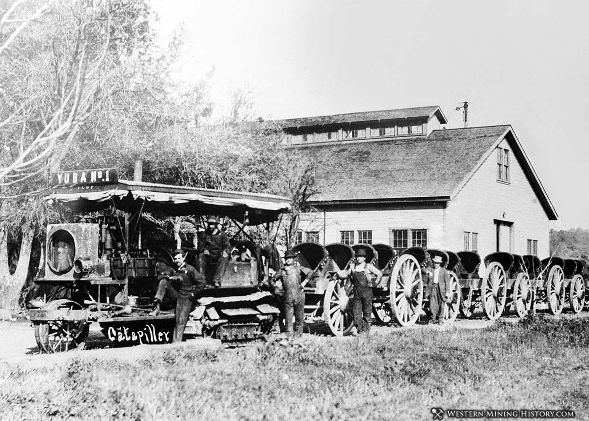 Tractor hauls dredge buckets fro mthe Yuba No. 1 dredge ca. 1904