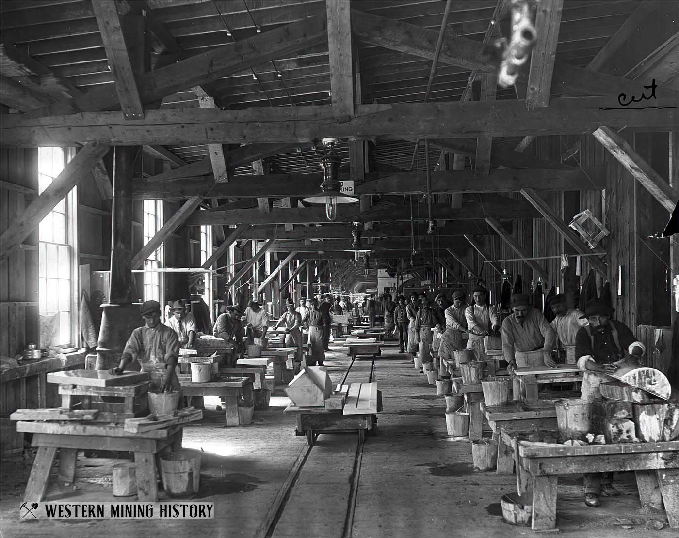 Workers hand polish marble slabs at the Yule Marble Co. finishing mill