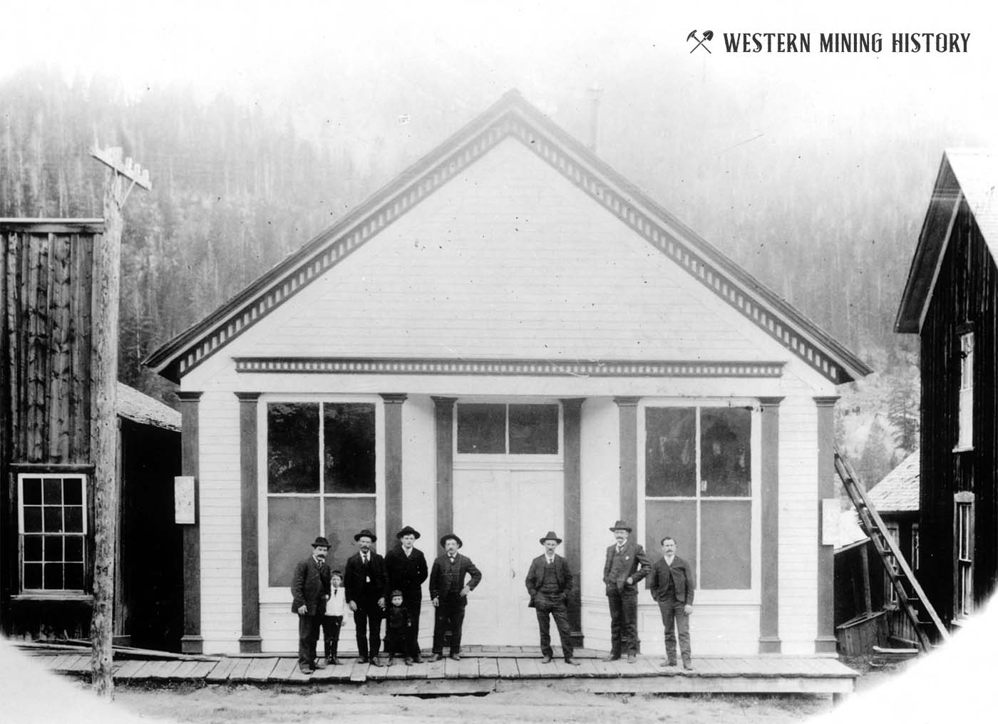 Men posing in front of a building at Montezuma, Colorado