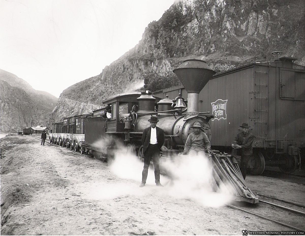 Narrow gauge Morenci Southern locomotive pulling slag cars. 