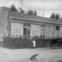 Citizens of Nevadaville Colorado pose in front of a commercial building 1883