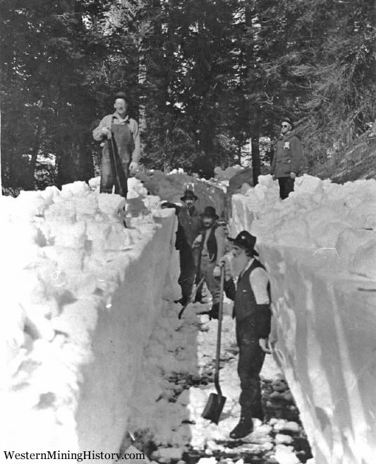 Men digging snow path - Cornucopia