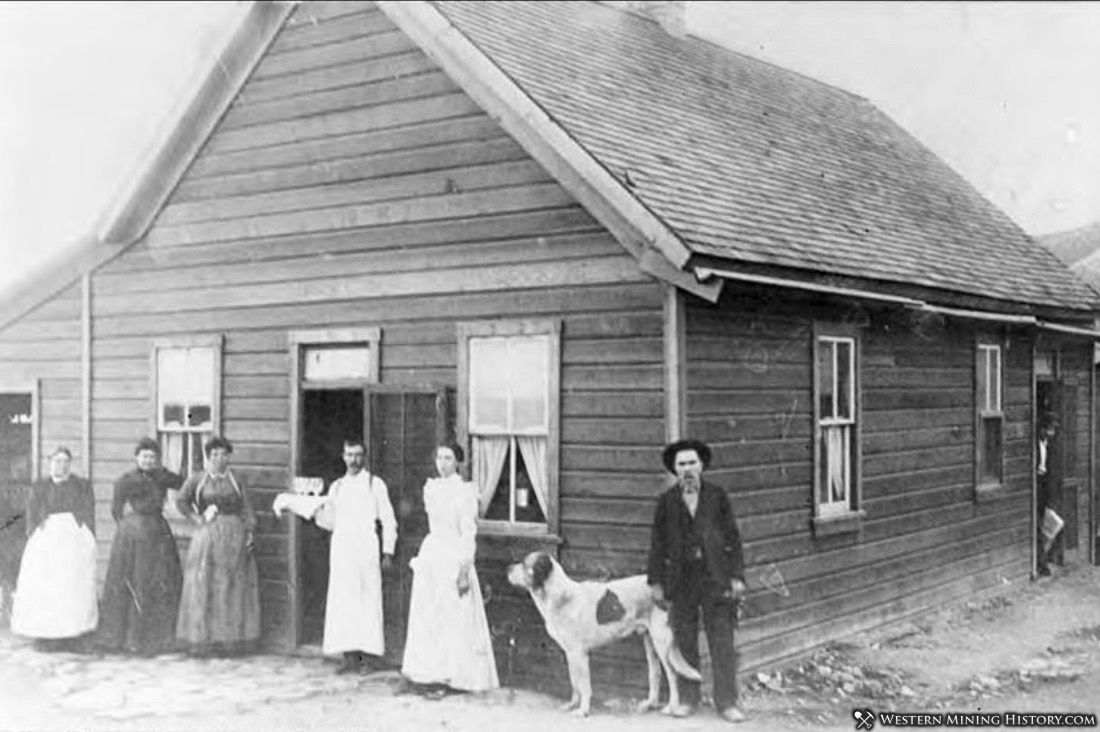 Dog poses with proprietors of a Boarding House in Silver City, Utah ca. 1880s